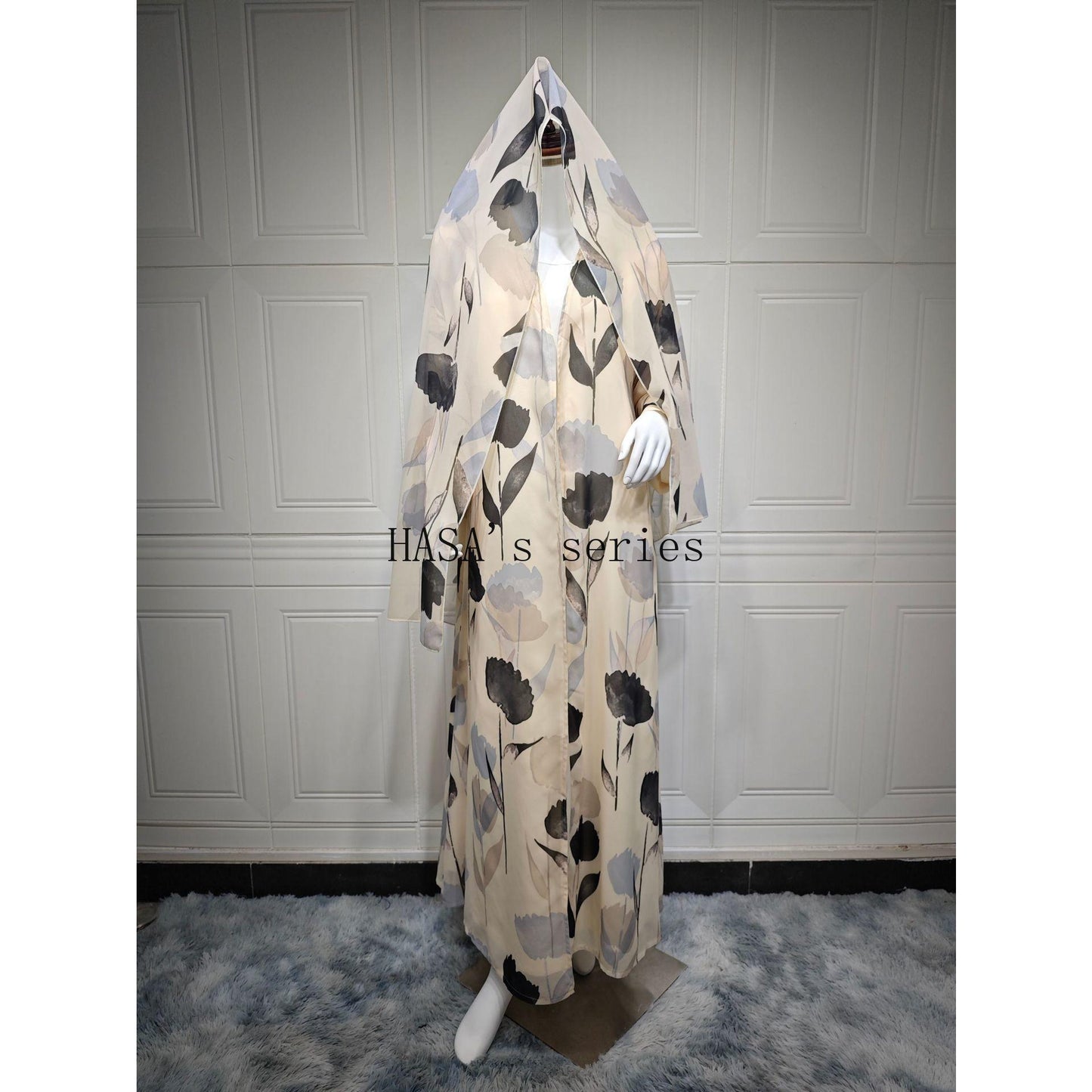 LUMAYA5092 A flowing, feminine floral-patterned robe, a loose-fitting printed cardigan-style dress paired with a headscarf.
