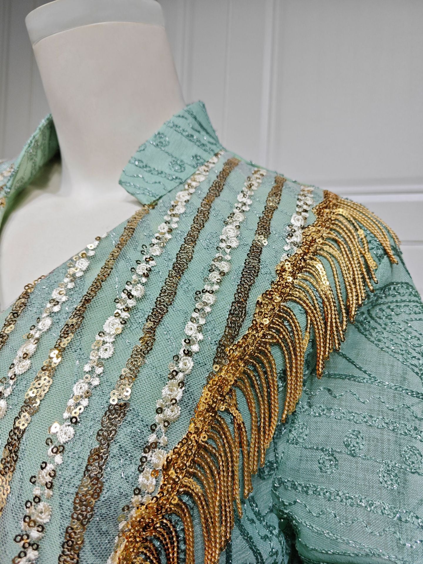 LM6648 A long robe with mesh sequins and embroidered details; an elegant and sophisticated dress.