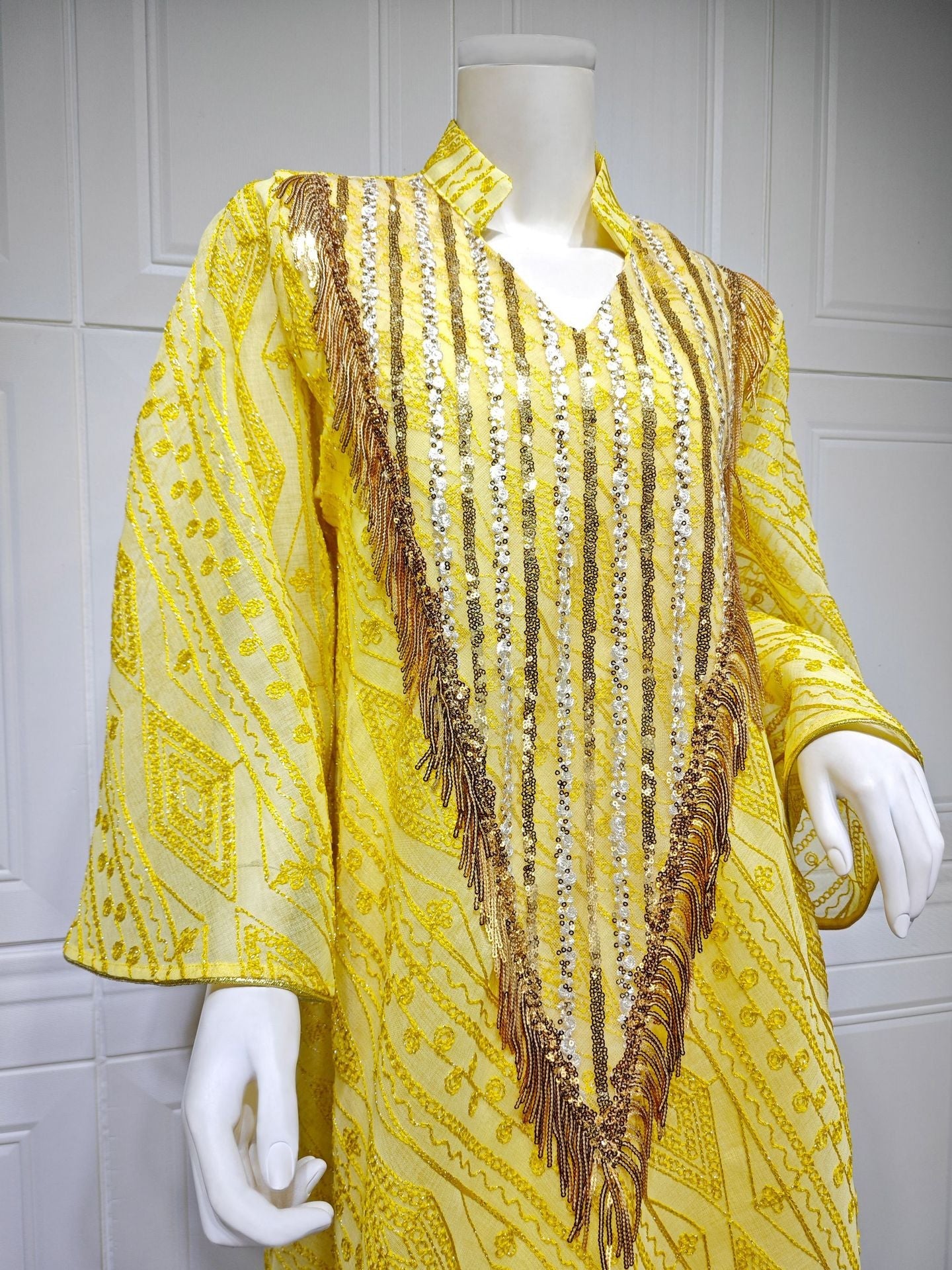 LM6648 A long robe with mesh sequins and embroidered details; an elegant and sophisticated dress.