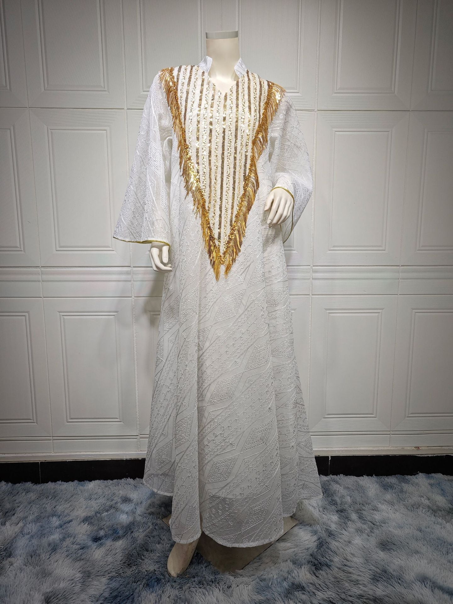 LM6648 A long robe with mesh sequins and embroidered details; an elegant and sophisticated dress.