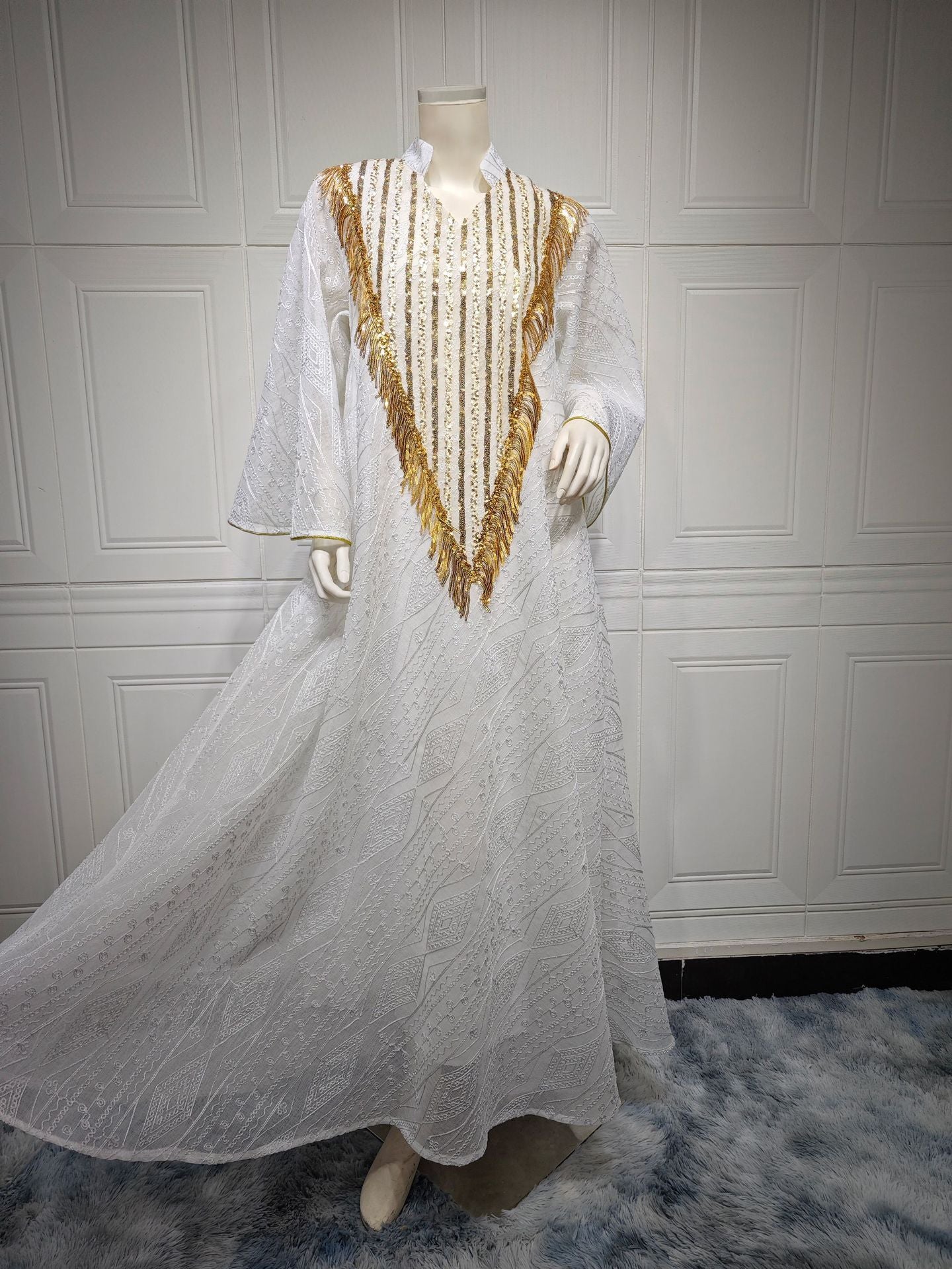 LM6648 A long robe with mesh sequins and embroidered details; an elegant and sophisticated dress.