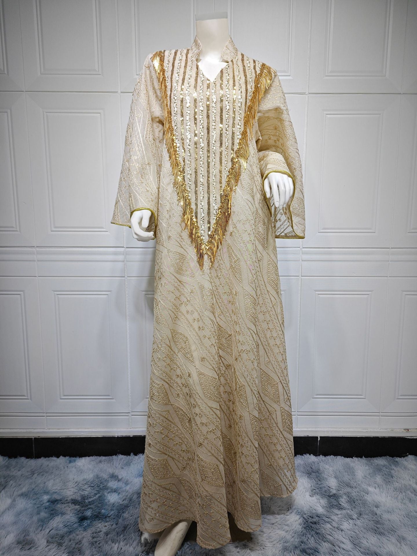LM6648 A long robe with mesh sequins and embroidered details; an elegant and sophisticated dress.