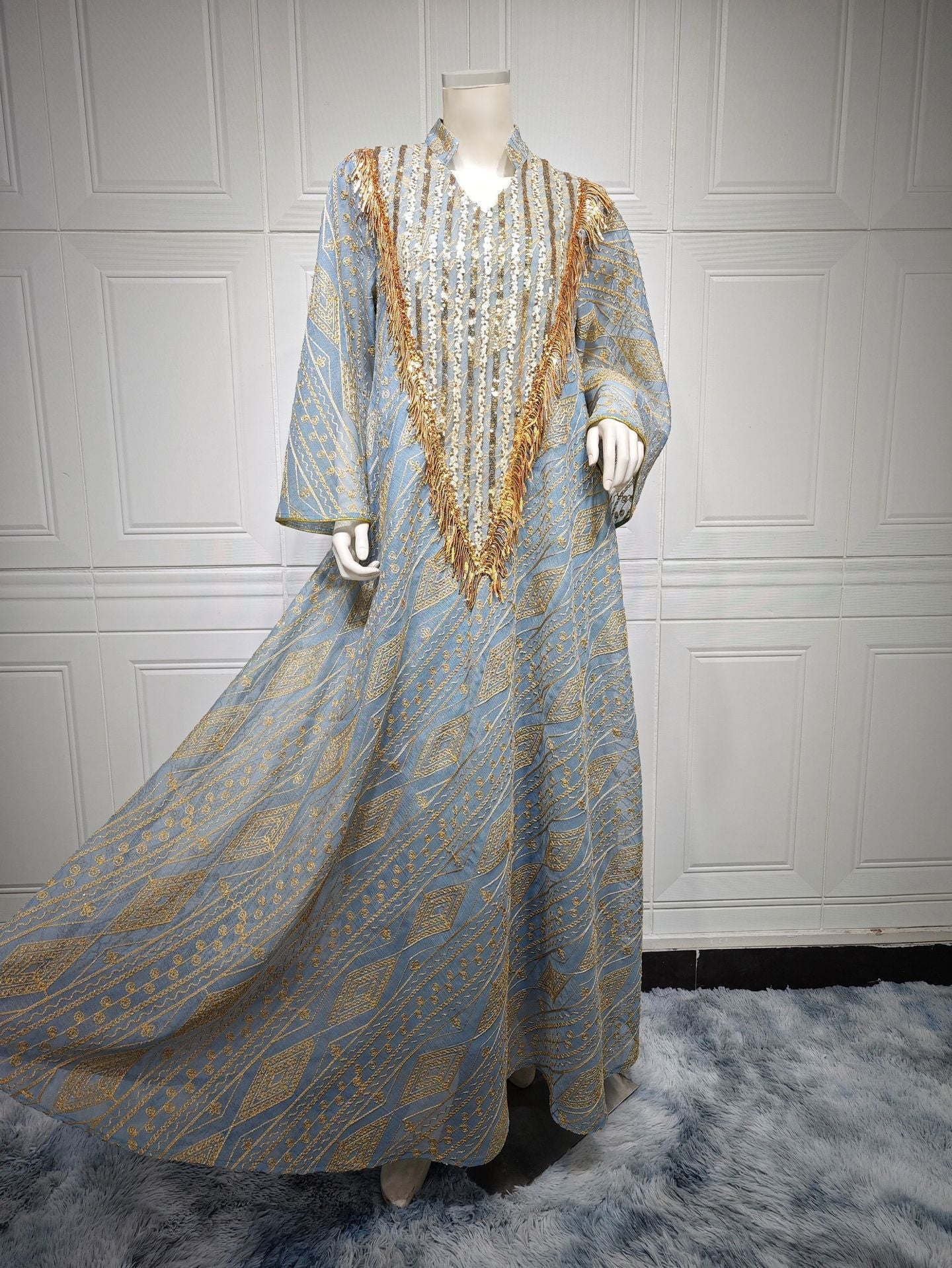LM6648 A long robe with mesh sequins and embroidered details; an elegant and sophisticated dress.