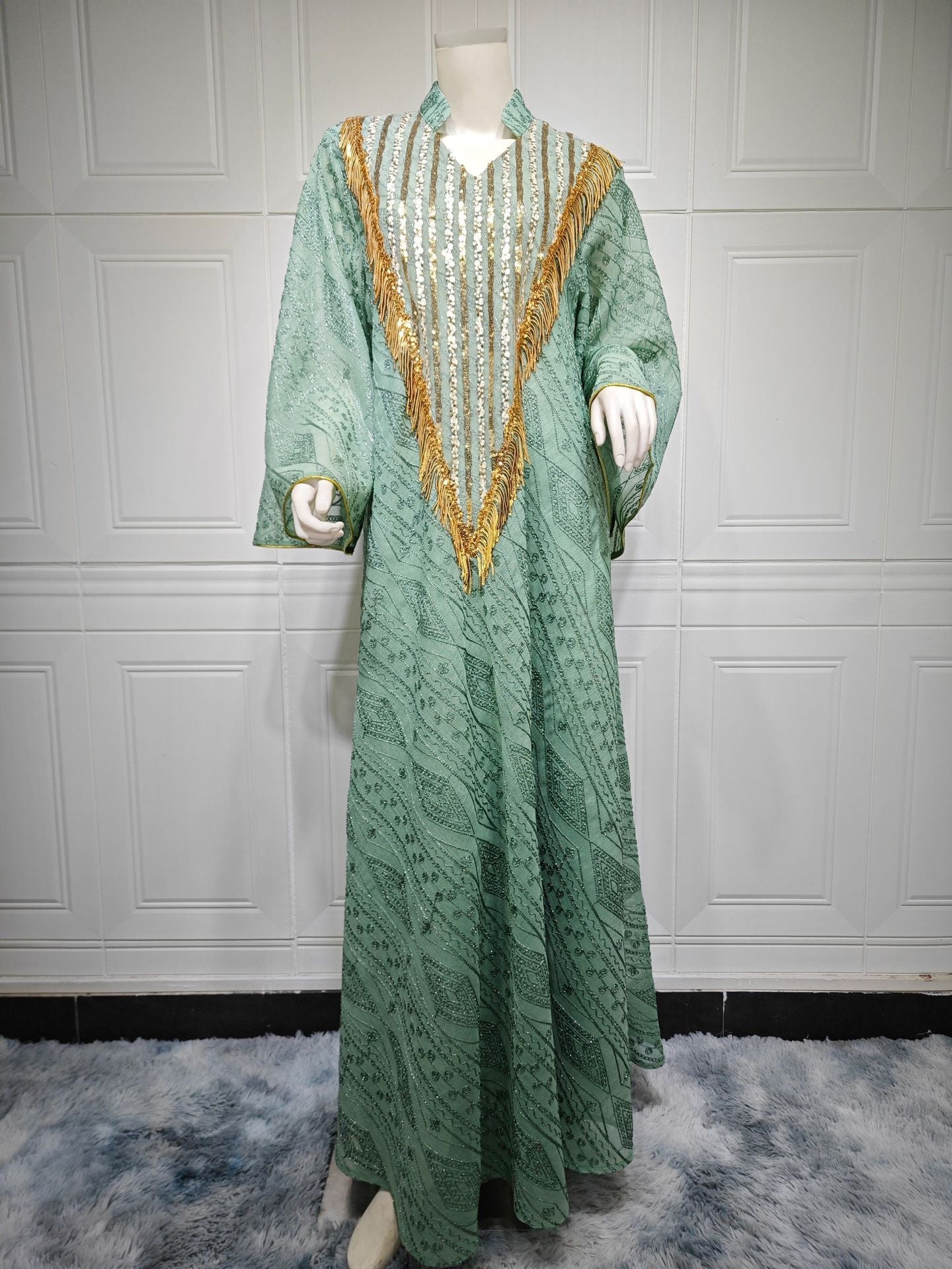 LM6648 A long robe with mesh sequins and embroidered details; an elegant and sophisticated dress.