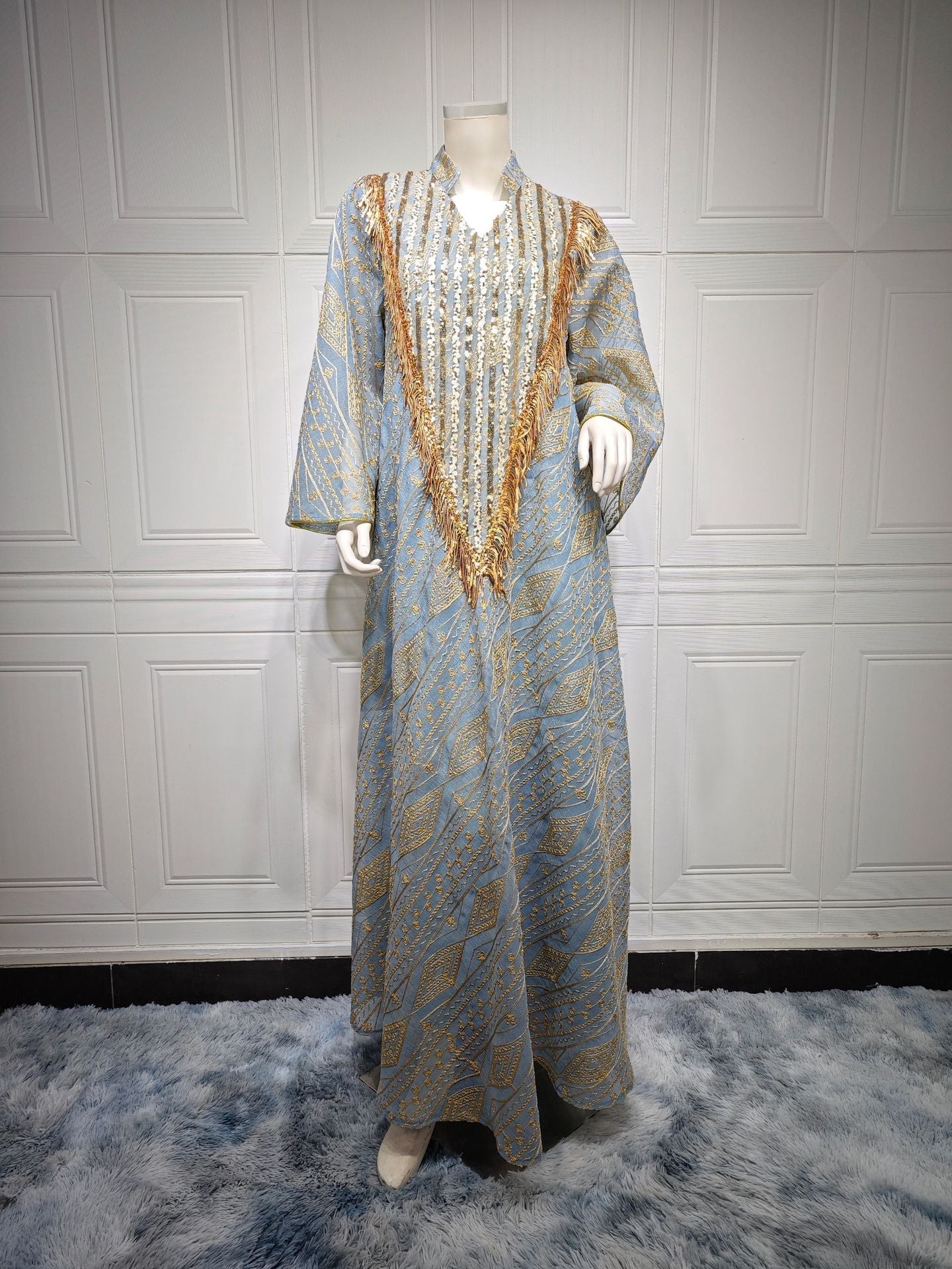 LM6648 A long robe with mesh sequins and embroidered details; an elegant and sophisticated dress.