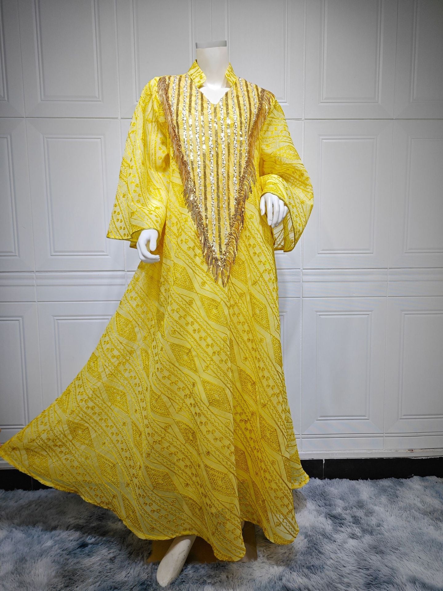 LM6648 A long robe with mesh sequins and embroidered details; an elegant and sophisticated dress.