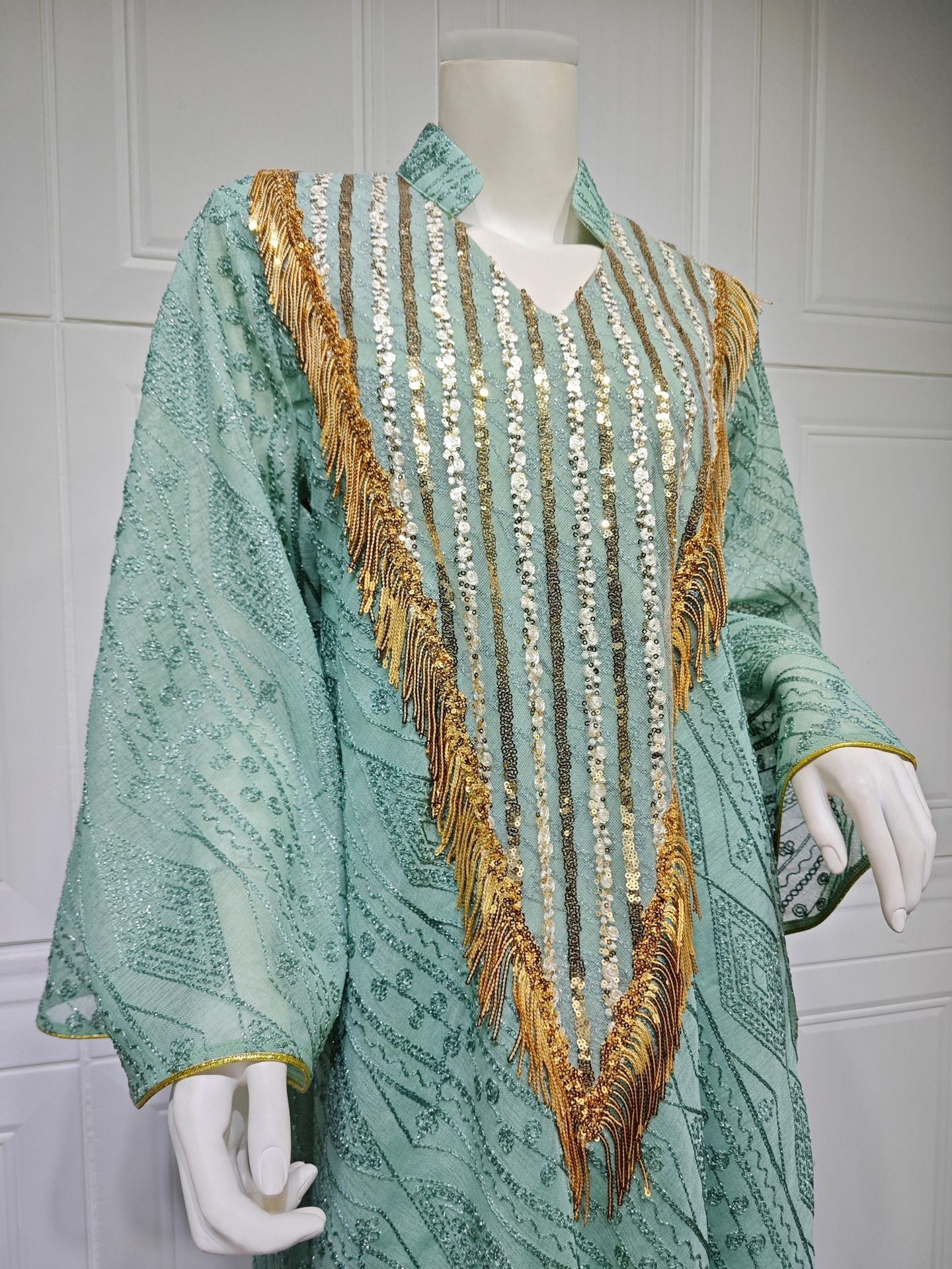 LM6648 A long robe with mesh sequins and embroidered details; an elegant and sophisticated dress.