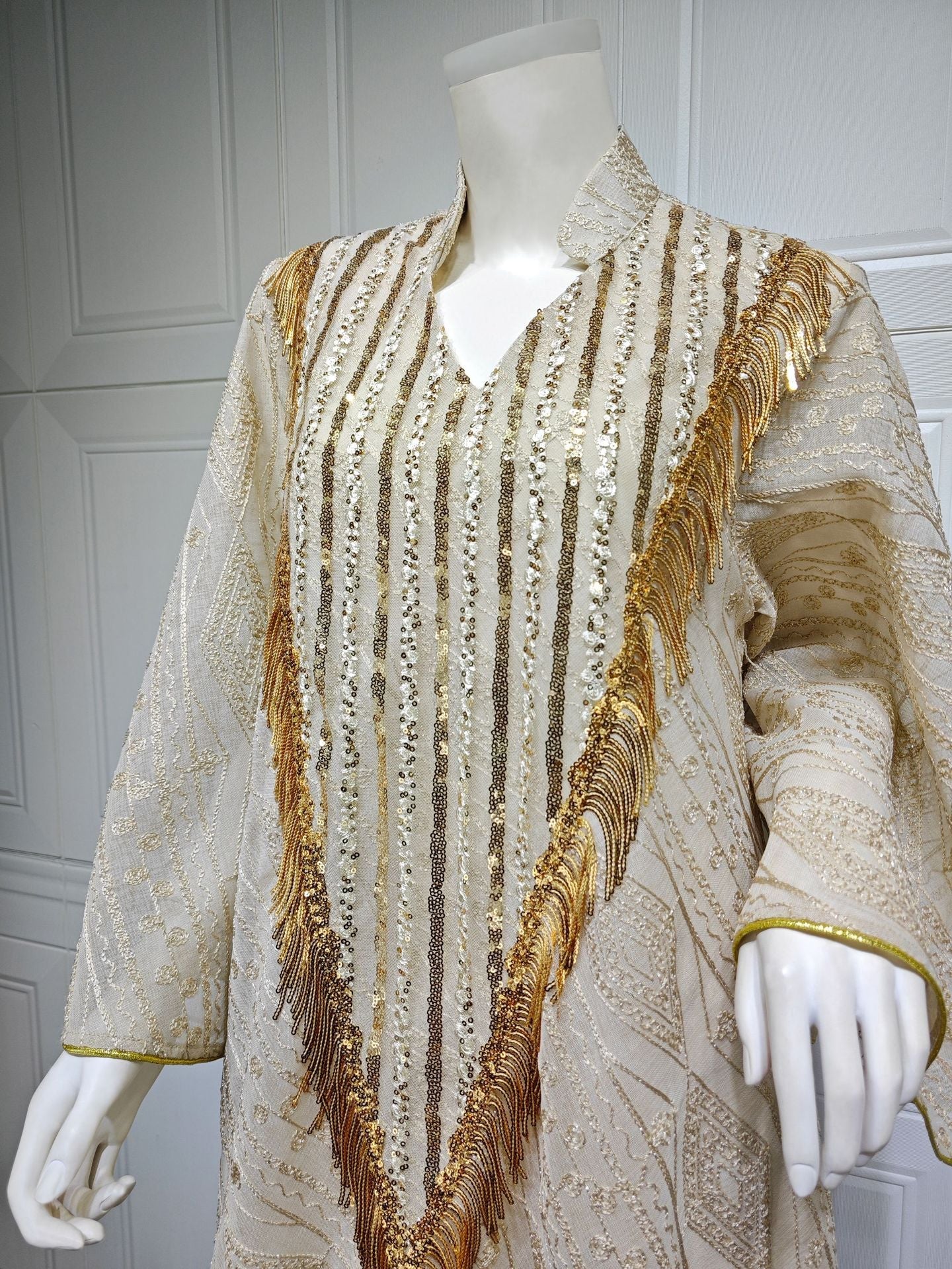 LM6648 A long robe with mesh sequins and embroidered details; an elegant and sophisticated dress.