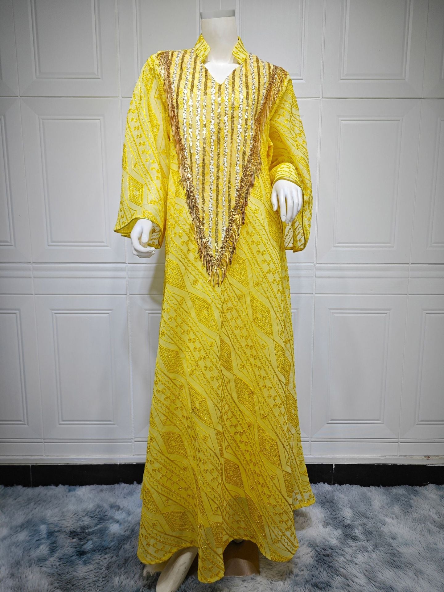 LM6648 A long robe with mesh sequins and embroidered details; an elegant and sophisticated dress.