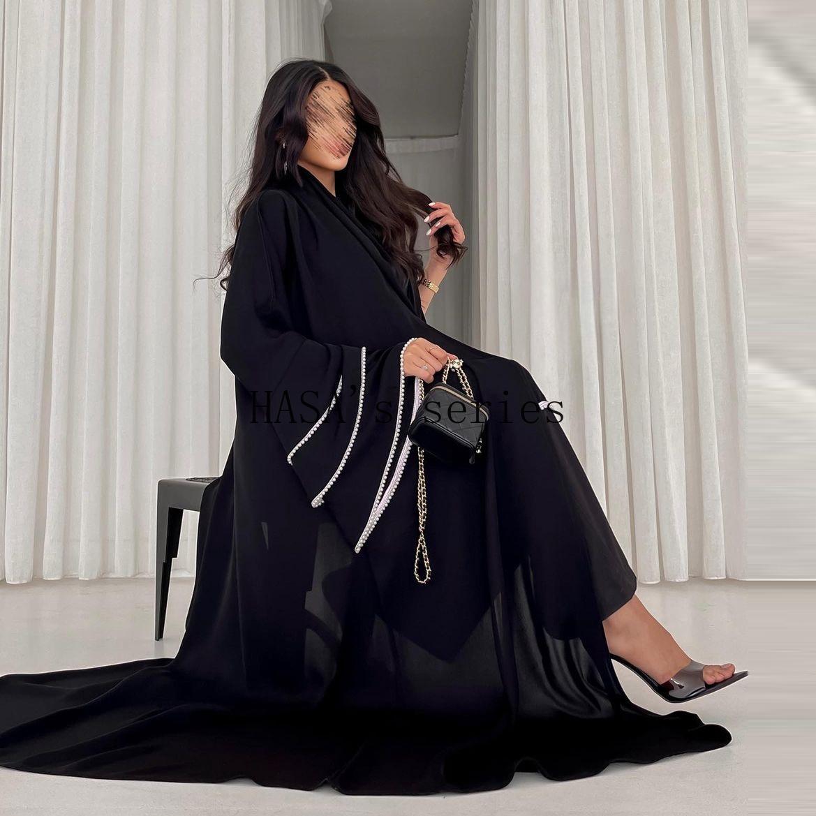 LUMAYA5093 Elegant black cardigan-style long robe with wide sleeves and a round-neck dress design featuring beaded embellishments.